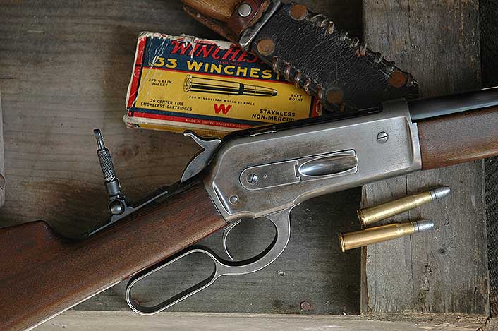 John Browning designed the Winchester 1886 rifle, using vertical locking lugs per his single-shot.