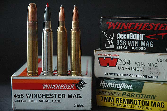 Winchester unveiled the short belted .458 (left) in 1956. Three fine elk rounds on that hull followed: from left, the .338 and .264 Winchester Magnums, and 7mm Remington Magnum.
